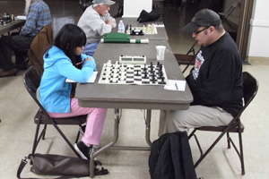Queena Deng (left) battling Oscar Ortiz in round 6.